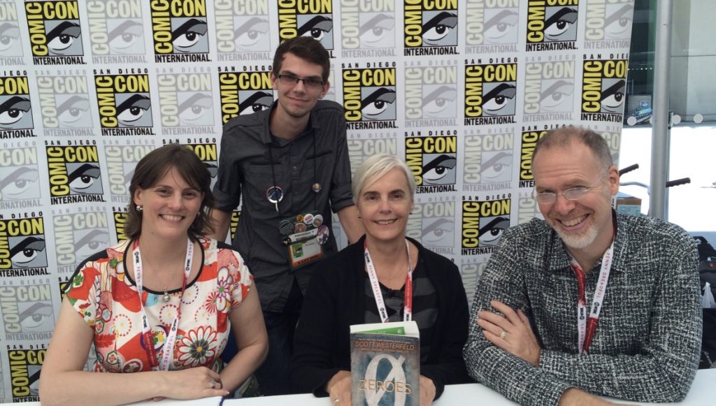 The collaborators, with the chair of their San Diego Comic-Con panel, David Mariotte.